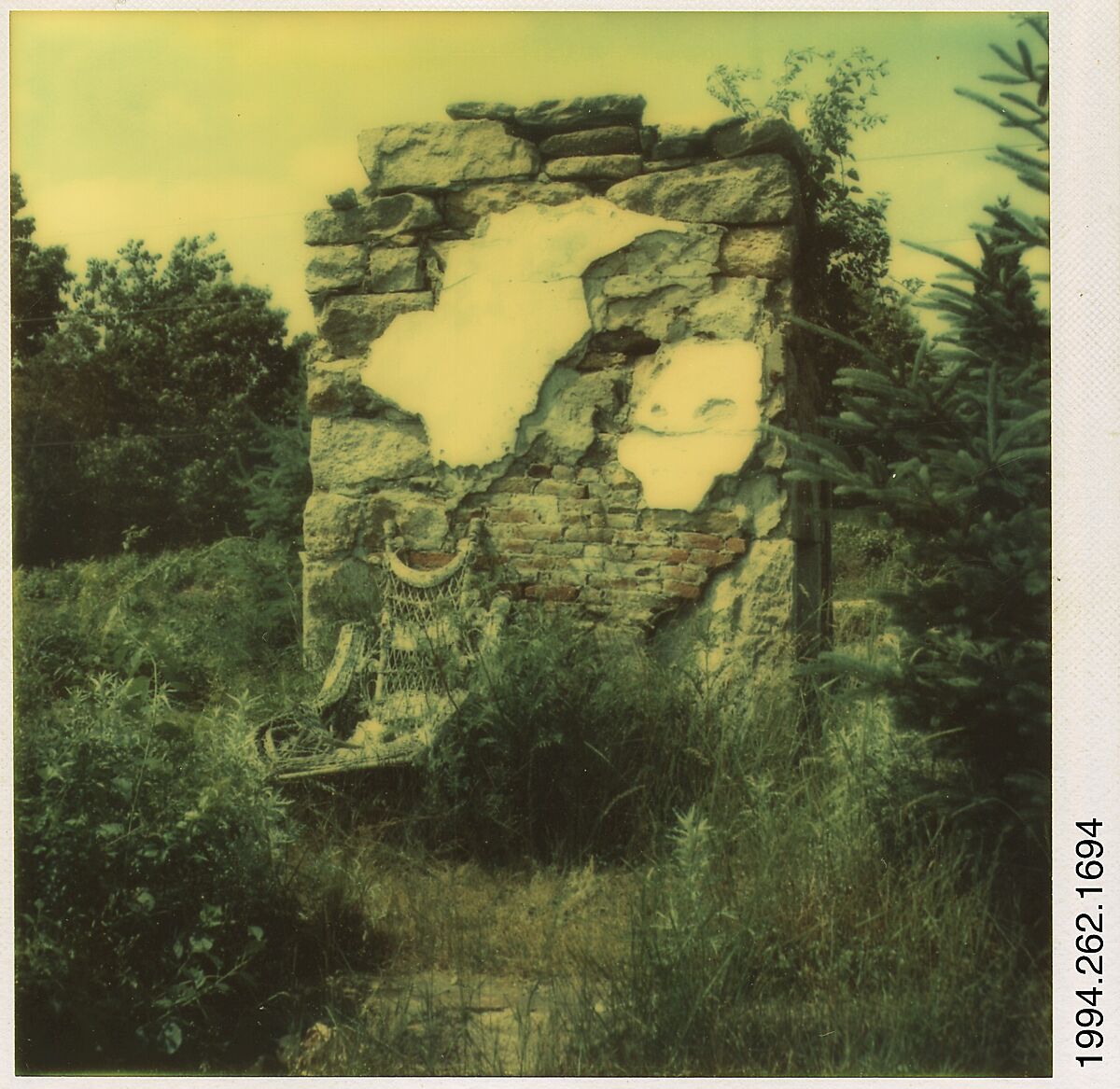 [Wicker Chair and Brick Ruin in Field], Walker Evans (American, St. Louis, Missouri 1903–1975 New Haven, Connecticut), Instant internal dye diffusion transfer print (Polaroid SX-70) 