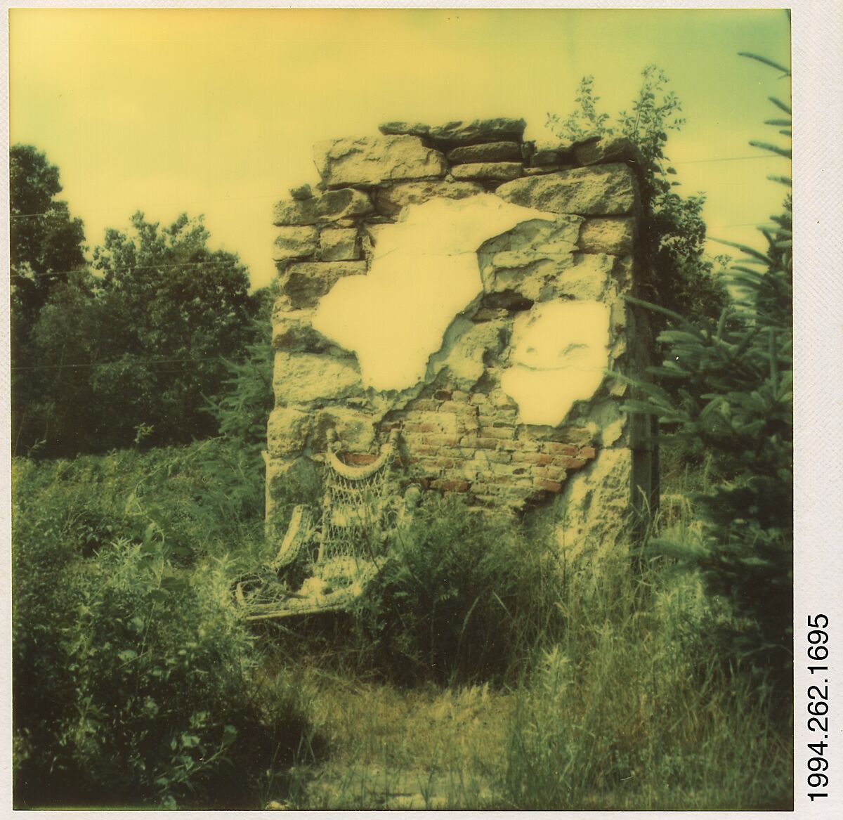 [Wicker Chair and Brick Ruin in Field], Walker Evans (American, St. Louis, Missouri 1903–1975 New Haven, Connecticut), Instant internal dye diffusion transfer print (Polaroid SX-70) 