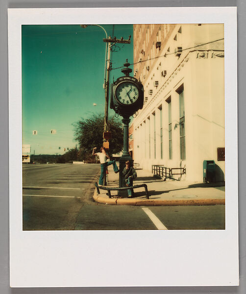 [Two Boys Eating Apples Under Clock Sign On Street Corner], Walker Evans (American, St. Louis, Missouri 1903–1975 New Haven, Connecticut), Instant internal dye diffusion transfer print (Polaroid SX-70) 