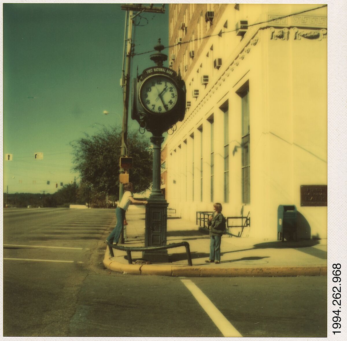 [Two Boys Under Clock Sign on Street Corner], Walker Evans (American, St. Louis, Missouri 1903–1975 New Haven, Connecticut), Instant internal dye diffusion transfer print (Polaroid SX-70) 