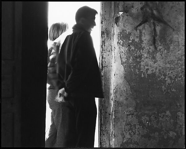 [Guy Davenport and Unidentified Woman in Doorway with Stretched Animal Carcass on Wall], Ralph Eugene Meatyard (American, 1925–1972), Gelatin silver print 