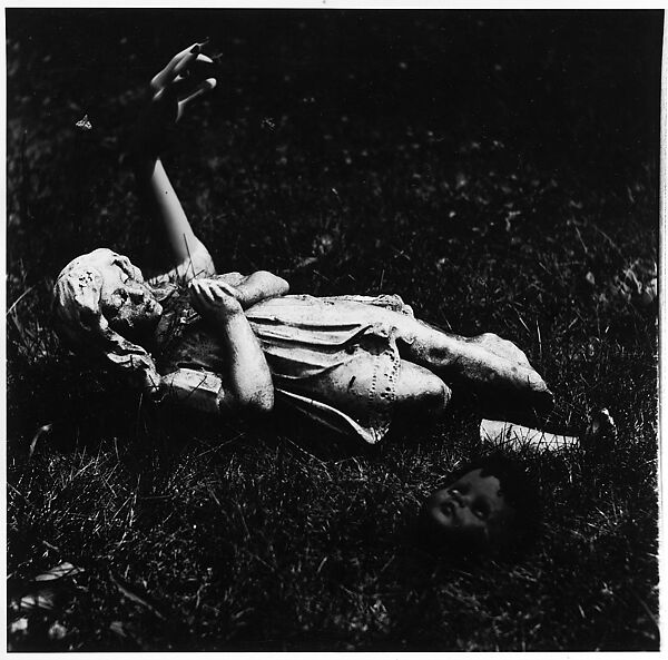 [Praying Female Statuette on Ground Next to Mannequin Arm and Doll Head], Ralph Eugene Meatyard (American, 1925–1972), Gelatin silver print 