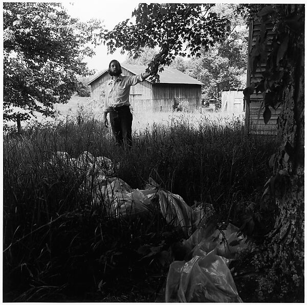[Man in Yard, Holding Limb of Tree], Ralph Eugene Meatyard (American, 1925–1972), Gelatin silver print 