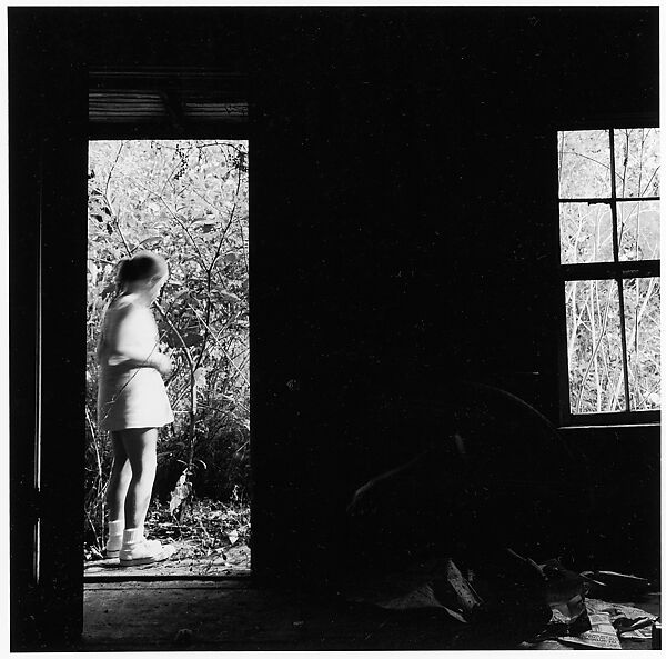[View Through Doorway of Standing Girl with Crouching Man Inside], Ralph Eugene Meatyard (American, 1925–1972), Gelatin silver print 