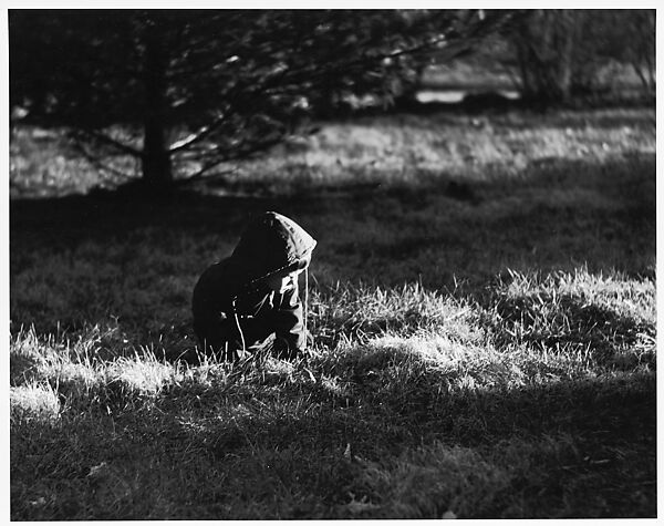 [Boy Wearing Hooded Jacket, Seated in Grass], Ralph Eugene Meatyard (American, 1925–1972), Gelatin silver print 