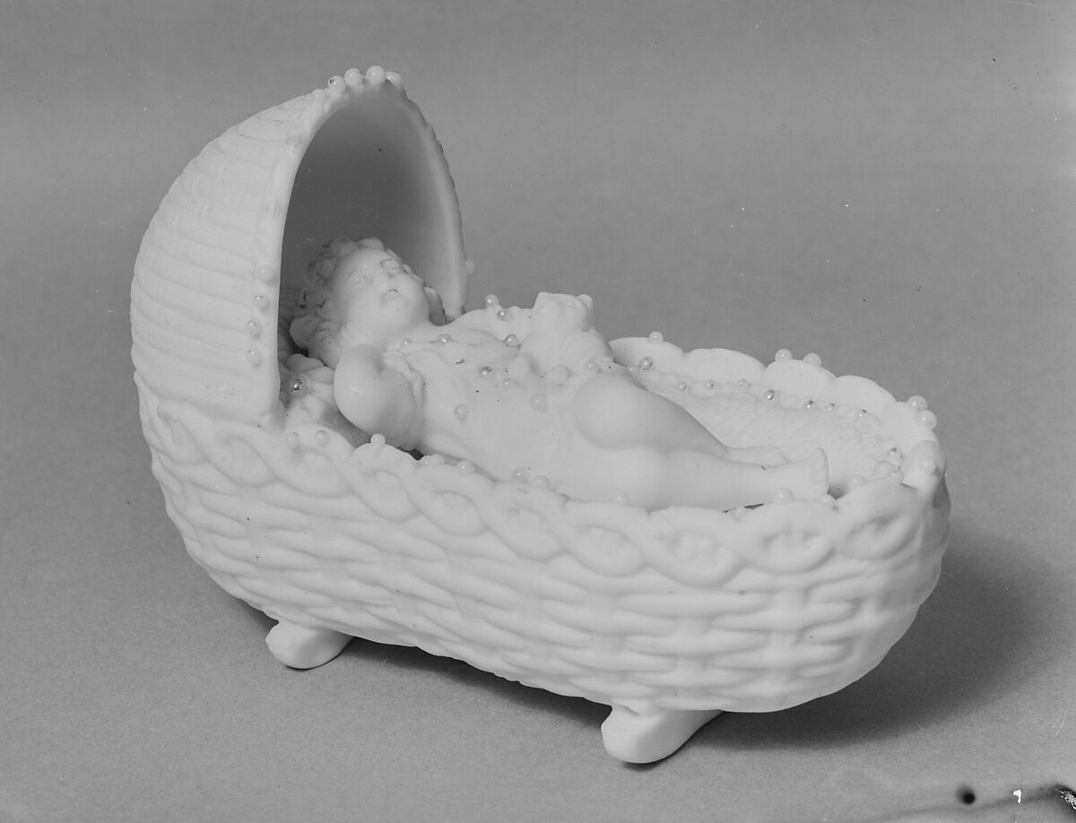 Figure of a Baby in a Cradle Holding a Kitten, Parian porcelain, American 
