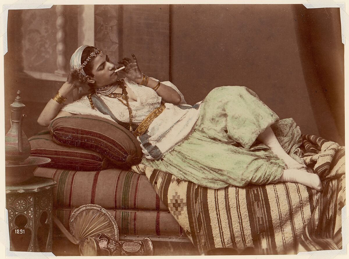 [Reclining Woman Smoking], Unknown, Albumen silver print from glass negative with applied color 