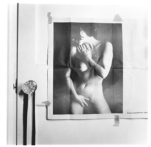 [Two Prints of Photograph of Nude Woman Taped to Door]