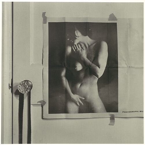 [Two Prints of Photograph of Nude Woman Taped to Door]
