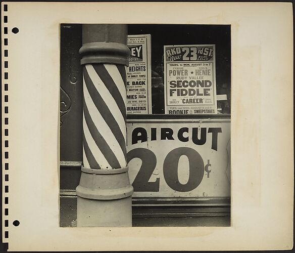 [Barber Shop Facade Detail with Pole in Foreground and Movie House Posters in Window, New York City]
