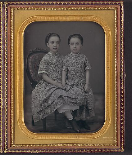 [Two Girls in Identical Dresses]