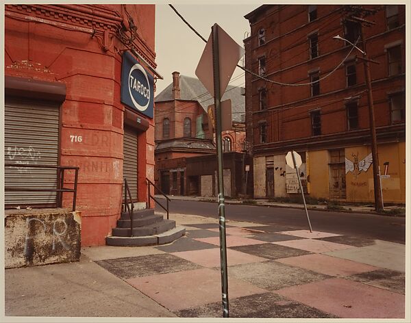 [Red Corner Building with Checkerboard Sidewalk, New York City], Jerry Shore (American, 1935–1994), Chromogenic print 