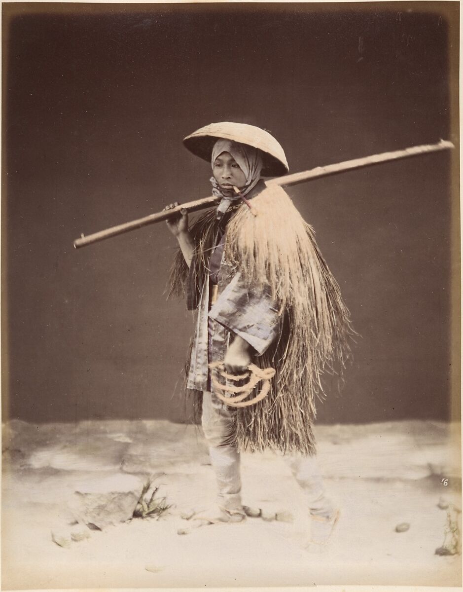 Farm laborer with rain coat (mino), Suzuki Shin&#39;ichi (Japanese, 1835–1919), Albumen silver print from glass negative with applied color 