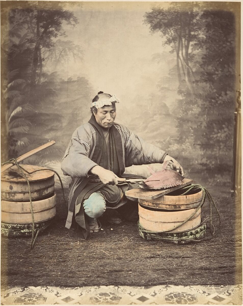 [Japanese Man Preparing a Fish], Suzuki Shin&#39;ichi (Japanese, 1835–1919), Albumen silver print from glass negative with applied color 