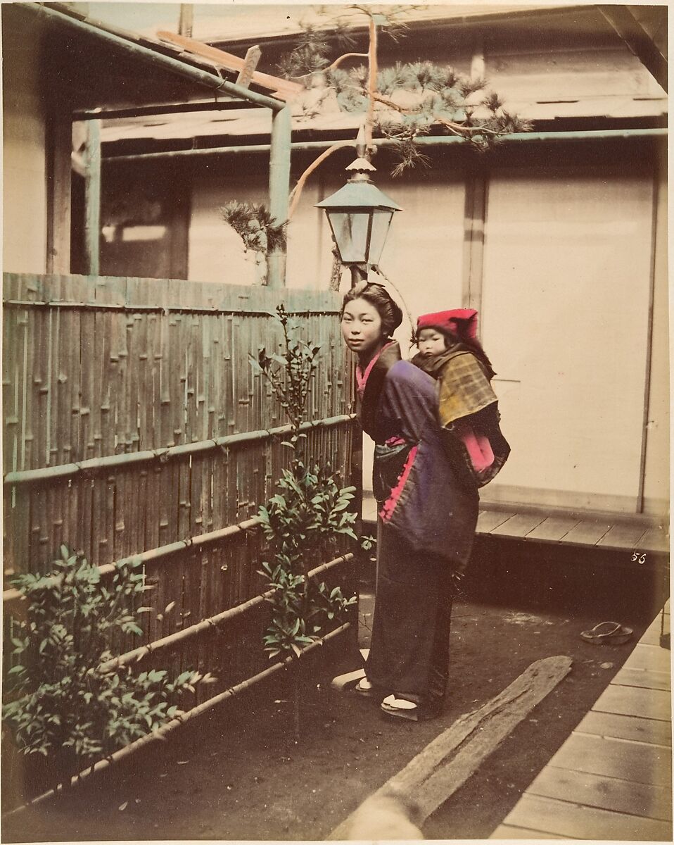 [Japanese Woman in Traditional Dress Posing with a Child on her Back], Suzuki Shin&#39;ichi (Japanese, 1835–1919), Albumen silver print from glass negative with applied color 