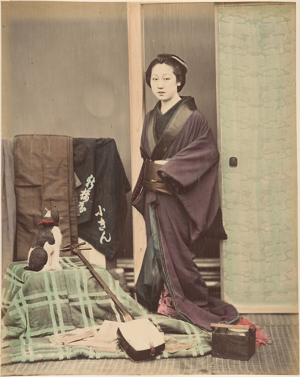 [Japanese Woman in Traditional Dress Posing with Cat and Instrument], Suzuki Shin&#39;ichi (Japanese, 1835–1919), Albumen silver print from glass negative with applied color 