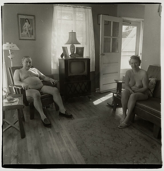 Diane Arbus Retired man and his wife at home in a nudist camp one morning,