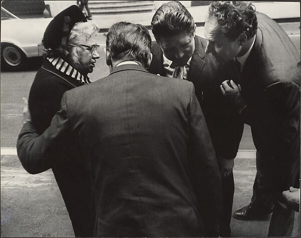 [Woman in Hat Conversing with Three Men in Suits, on Street, New York], Leon Levinstein (American, Buckhannon, West Virginia 1910–1988 New York), Gelatin silver print 