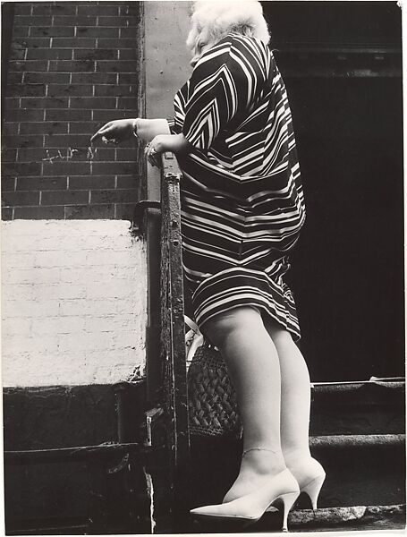 [Street Scene: Woman in Striped Dress on Stoop, New York City], Leon Levinstein (American, Buckhannon, West Virginia 1910–1988 New York), Gelatin silver print 
