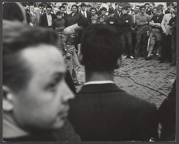 [Crowd Scene with Young Man in Chains, Portugal?], Leon Levinstein (American, Buckhannon, West Virginia 1910–1988 New York), Gelatin silver print 