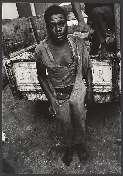 [Shoeless Man Standing Behind Pick-up Ttruck, Haiti], Leon Levinstein (American, Buckhannon, West Virginia 1910–1988 New York), Gelatin silver print 