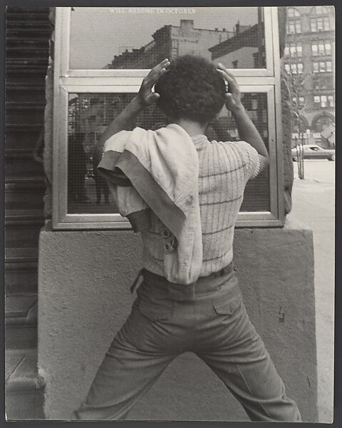 [Street Scene: Young Man Fixing Hair in Window, New York City], Leon Levinstein (American, Buckhannon, West Virginia 1910–1988 New York), Gelatin silver print 