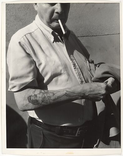 [Man in Short Sleeve Shirt with Tattoo of Female Nude on Forearm, New York City]