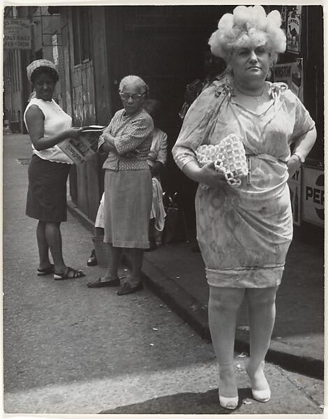 Leon Levinstein | [Street Scene: Woman in Blonde Wig and Tight