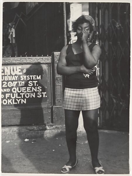 [Woman Wearing Headscarf, Tee Shirt, and Shorts, on Street at Subway Entrance, New York City], Leon Levinstein (American, Buckhannon, West Virginia 1910–1988 New York), Gelatin silver print 