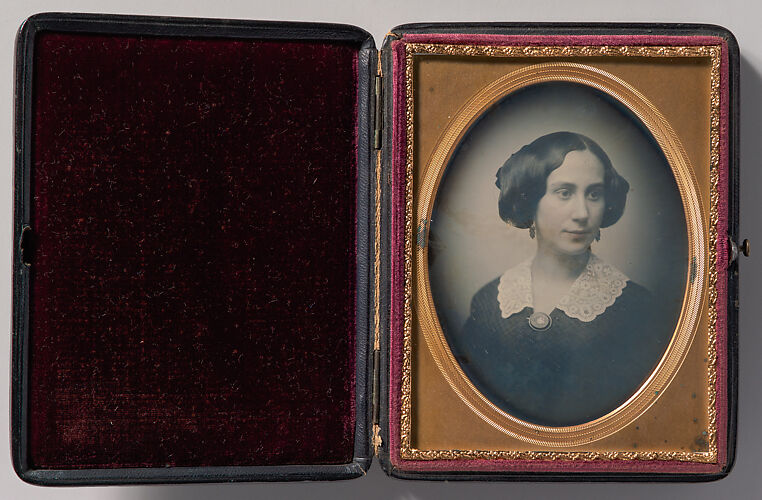 [Young Woman Wearing Lace Collar and Brooch]