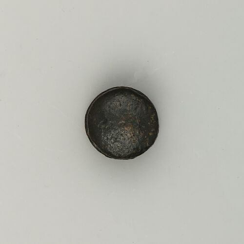 Button, maybe for a Horse Tack