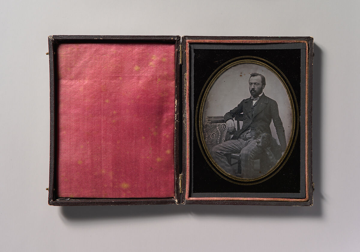 [Man Seated at Table with Dog], Unknown (French), Daguerreotype 