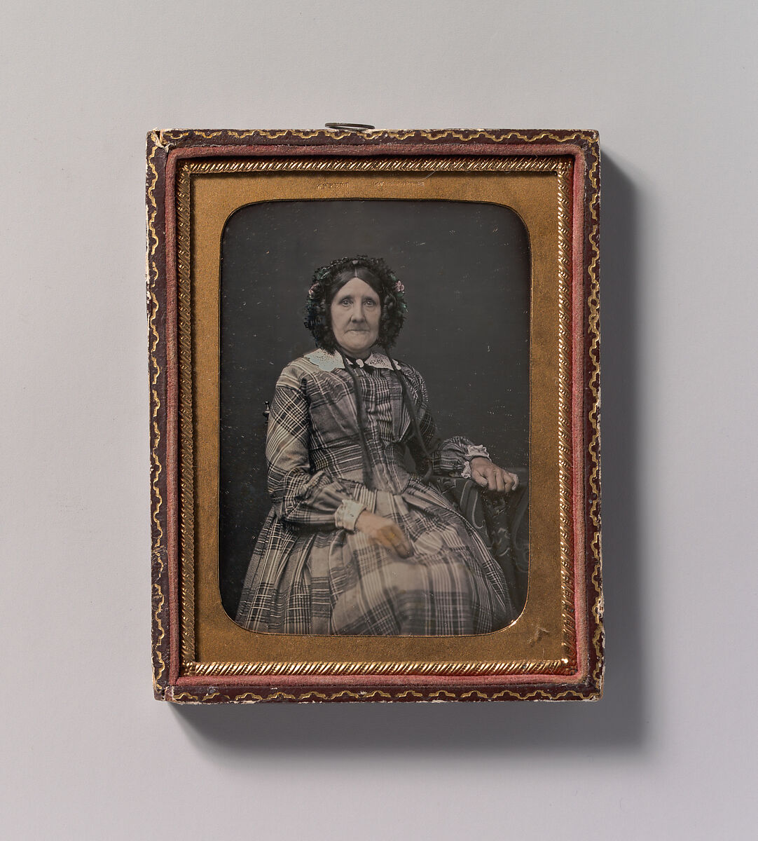 [Seated Elderly Woman Wearing Plaid Dress and Bonnet], William Hardy Kent (American, England 1819–1907 England), Daguerreotype with applied color 