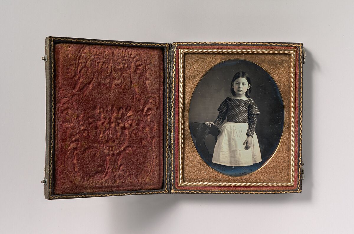 [Young Girl Wearing Waist Apron, Resting Hand on Chair], Unknown (American), Daguerreotype with applied color 