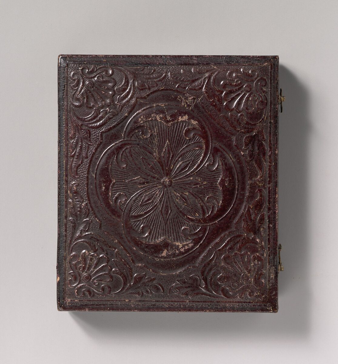 [Barefoot Boy Holding Hat and Drum Stick, Leaning Forearm on Child-sized Drum on Table], Unknown (American), Daguerreotype