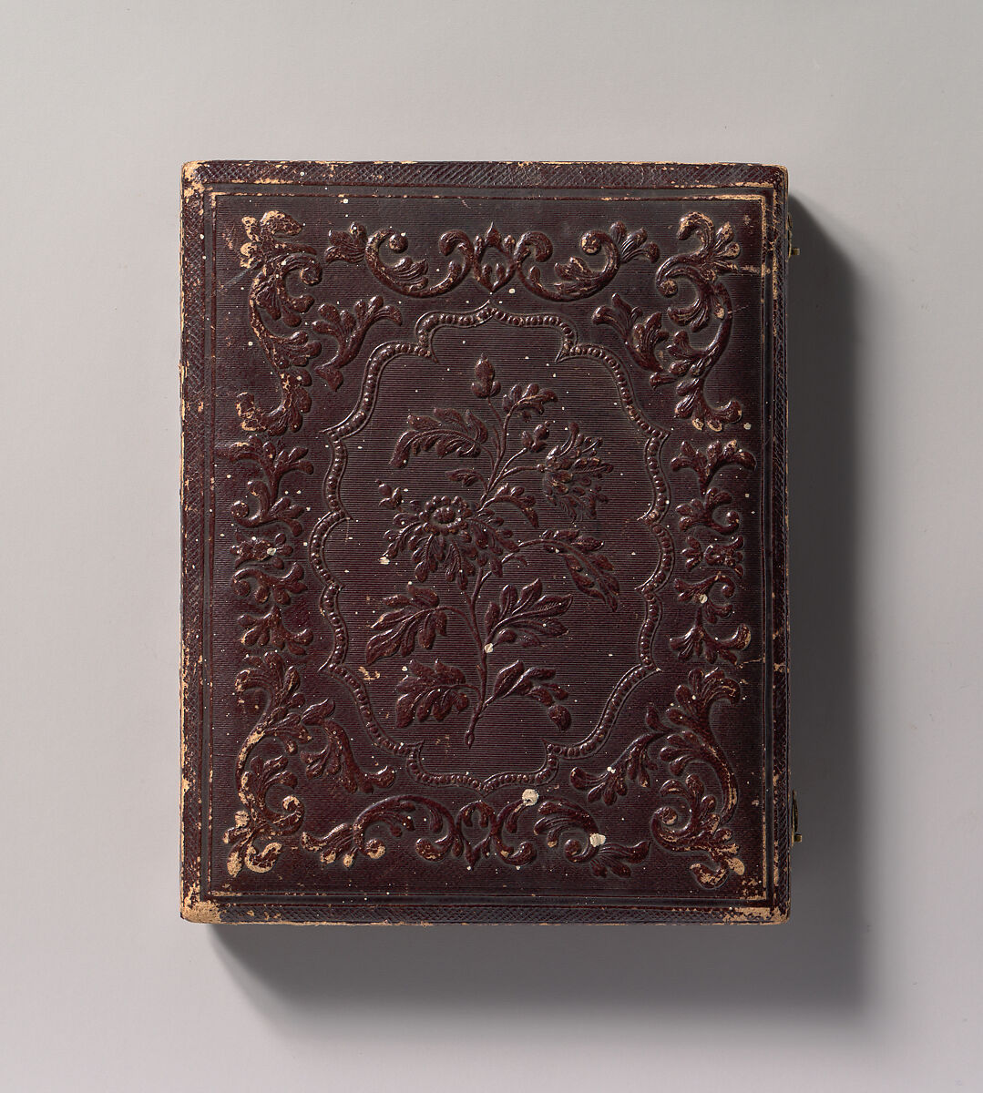 [Man Wearing Coat and Gloves, Holding Hat, Seated in Front of Painted Outdoor Backdrop], Attributed to Samuel Broadbent Jr. (American, 1810–1880), Daguerreotype with applied color