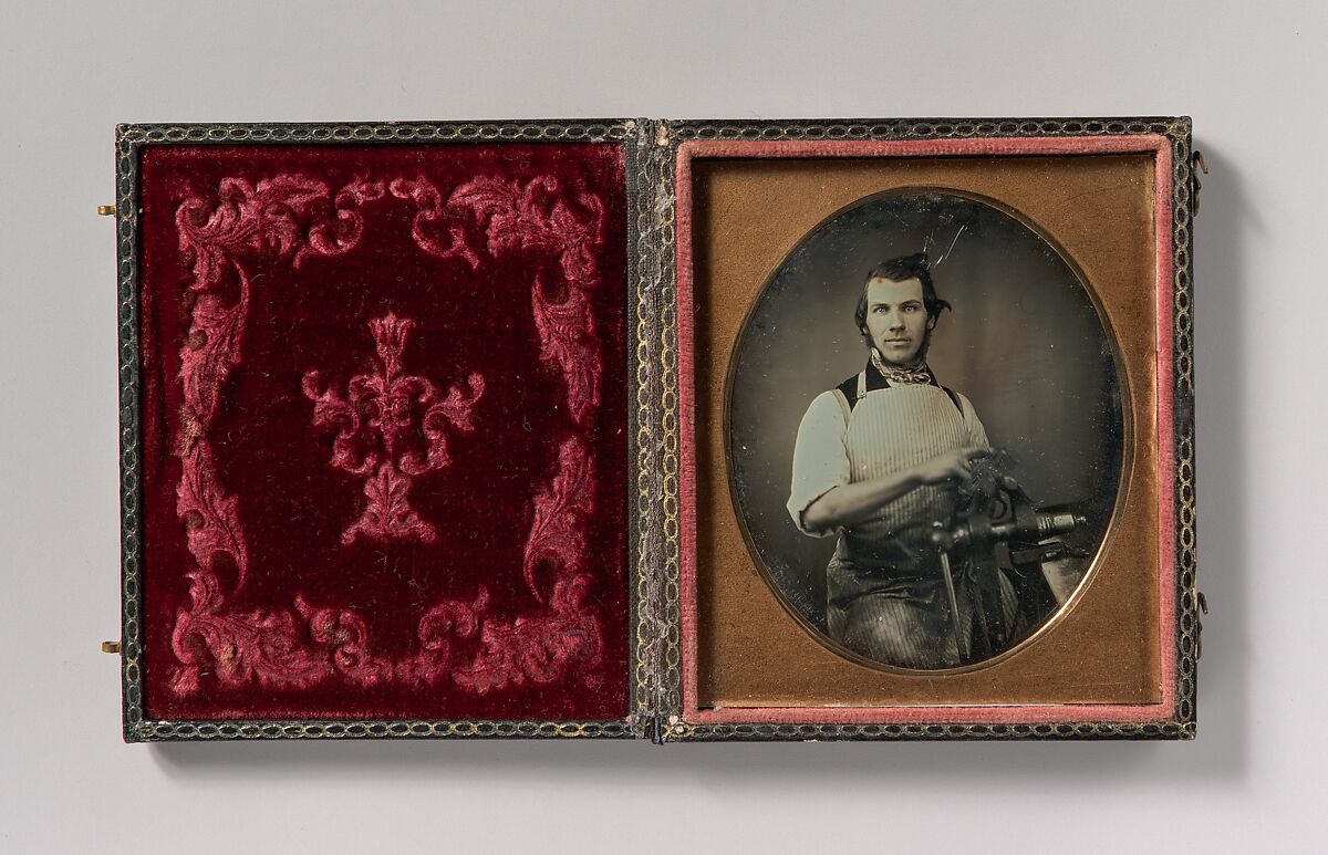 [Metalworker in Apron Working with a Vise], Unknown (American), Daguerreotype with applied color 