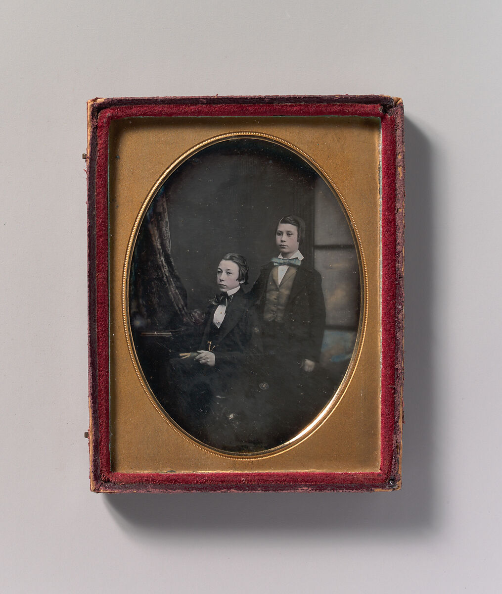 [Two Young Men in Bow Ties, One Seated Holding a Book, One Standing], Robert Boning (British, 1826–1878), Daguerreotype with applied color 