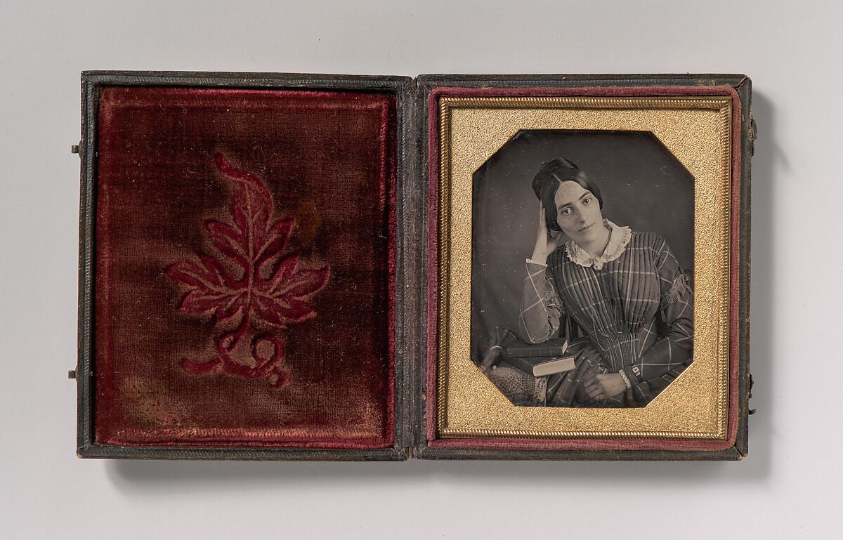 [Young Woman with Elbow Resting on Small Pile of Books and Head on Hand], Unknown (American), Daguerreotype with applied color 
