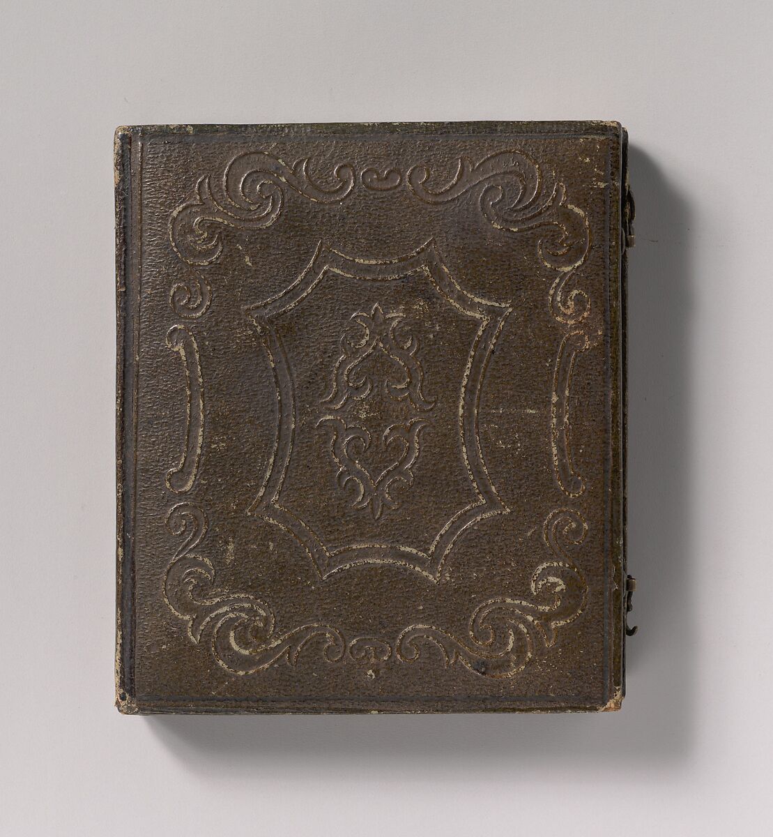 [Young Woman with Elbow Resting on Small Pile of Books and Head on Hand], Unknown (American), Daguerreotype with applied color