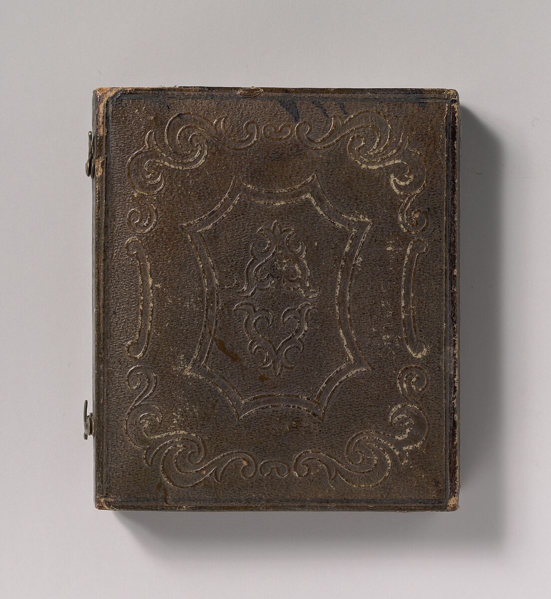 [Young Woman with Elbow Resting on Small Pile of Books and Head on Hand], Unknown (American), Daguerreotype with applied color