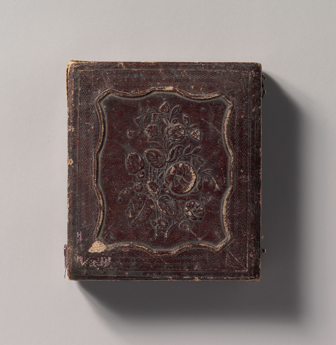 [Young Woman Seated Next to a Table with Elbow Resting on a Book], Unknown (American), Daguerreotype with applied color