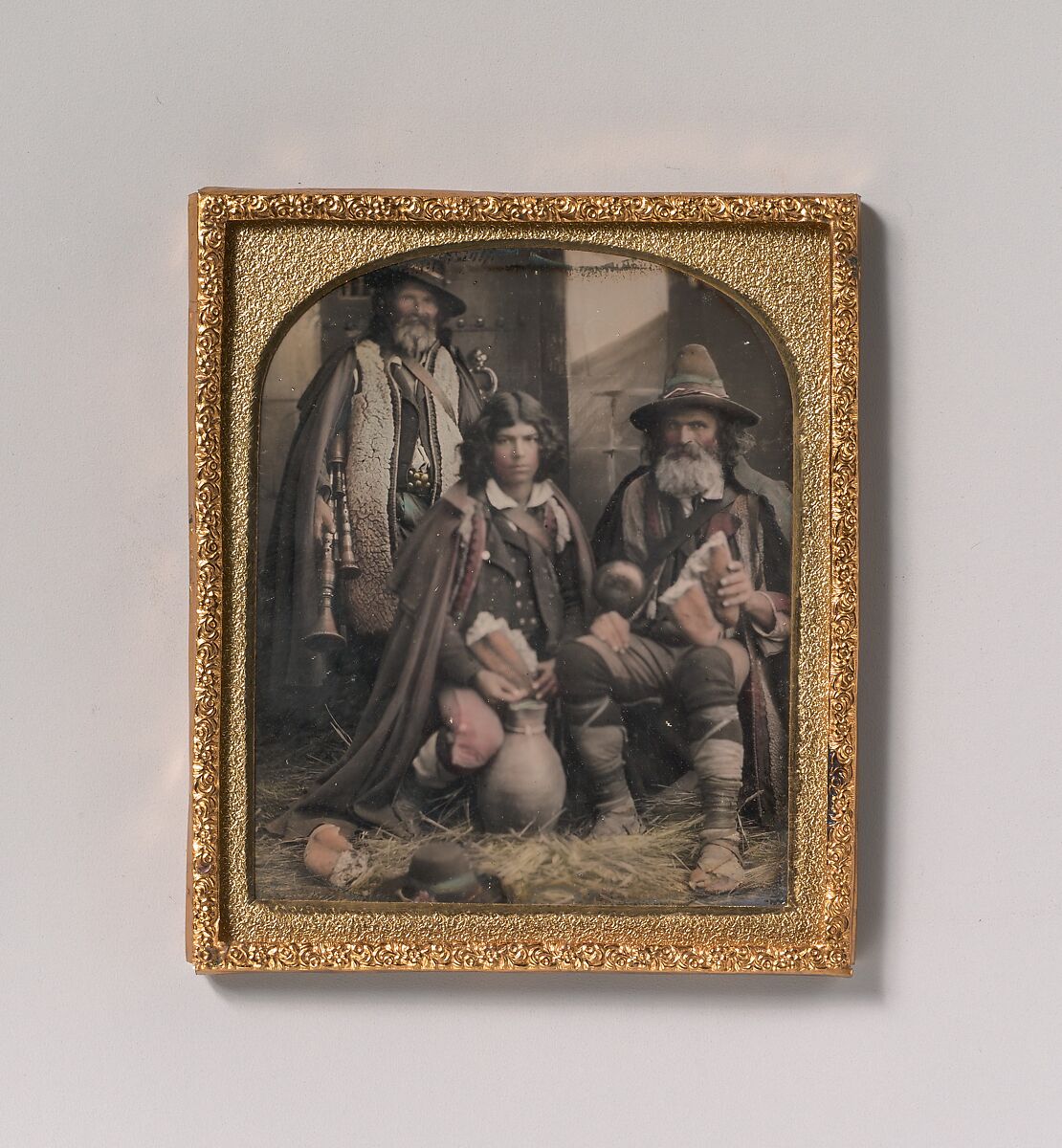 [Three Men in Shepherd Attire, One with Bagpipes, the Other Two Holding Bread], Unknown, Daguerreotype with applied color 