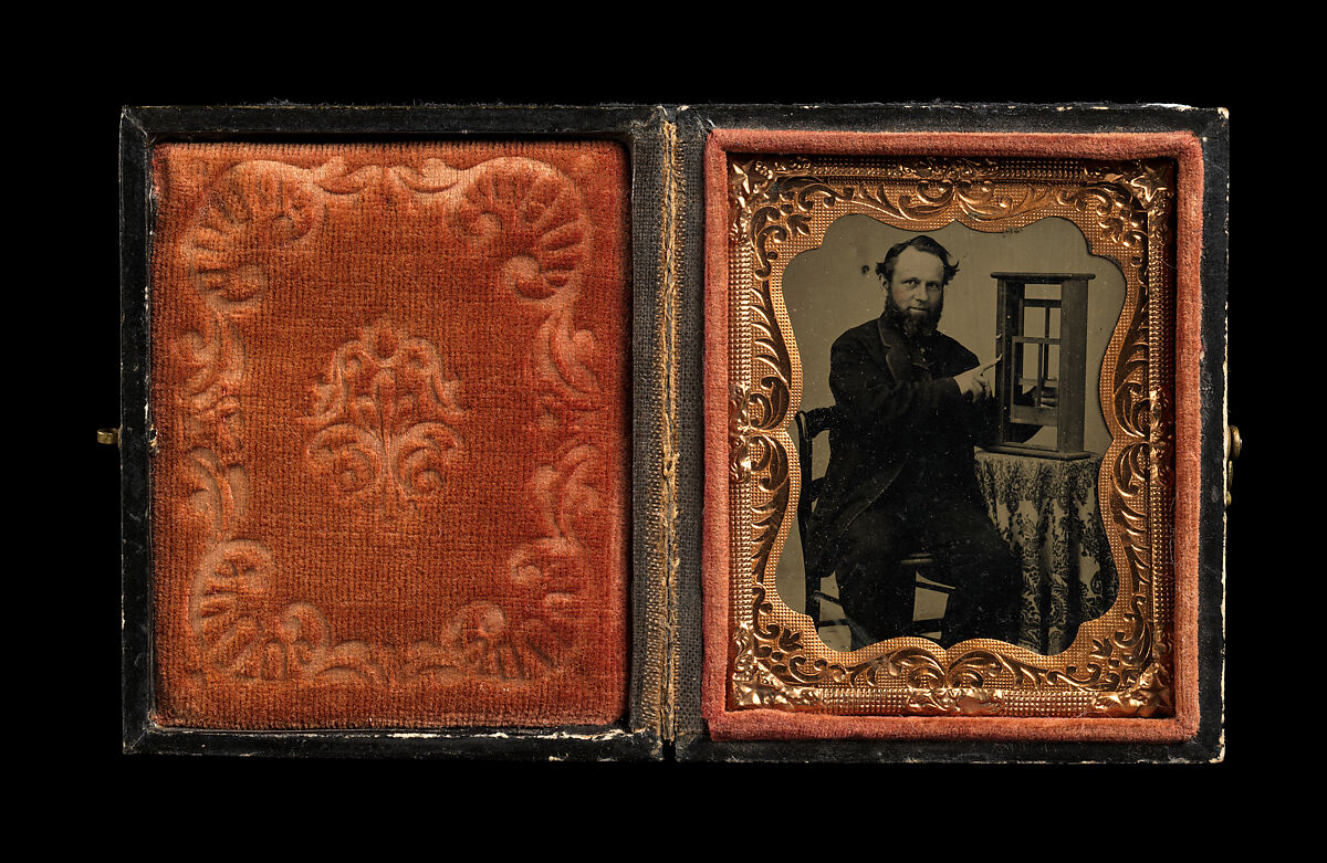 [Man Demonstrating Patent Model for Sash Window], Unknown, Tintype with applied color
