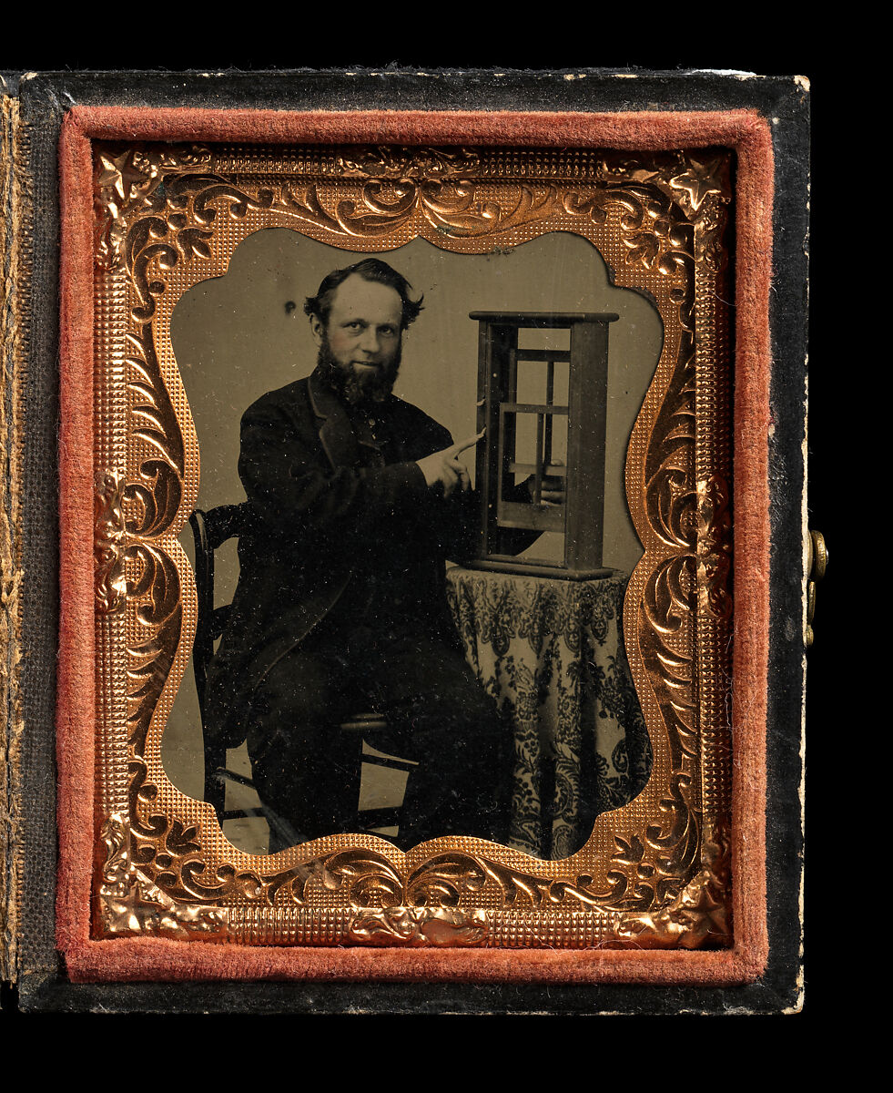 [Man Demonstrating Patent Model for Sash Window], Unknown (American), Tintype with applied color
