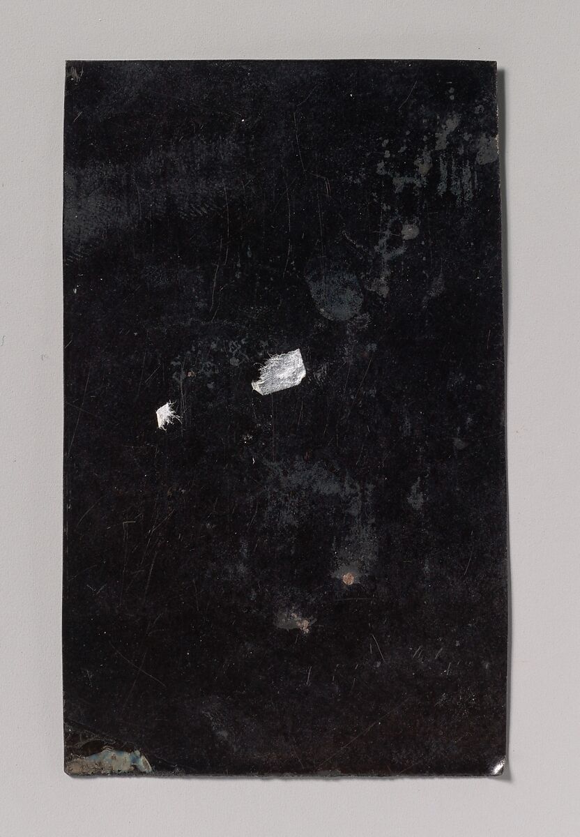 [Tinsmith with Coal Heater and Sheet of Tin], Unknown (American), Tintype with applied color