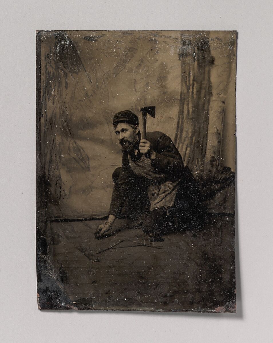 [Kneeling Carpenter Holding a Nail and Raised Hammer], Unknown (American), Tintype 