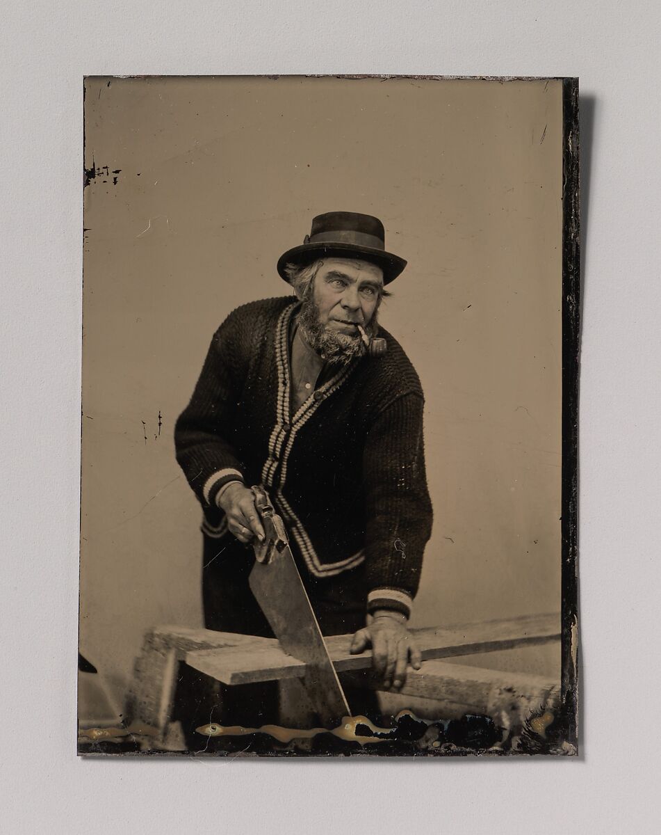 [Carpenter Sawing a Plank of Wood], Unknown (American), Tintype with applied color 