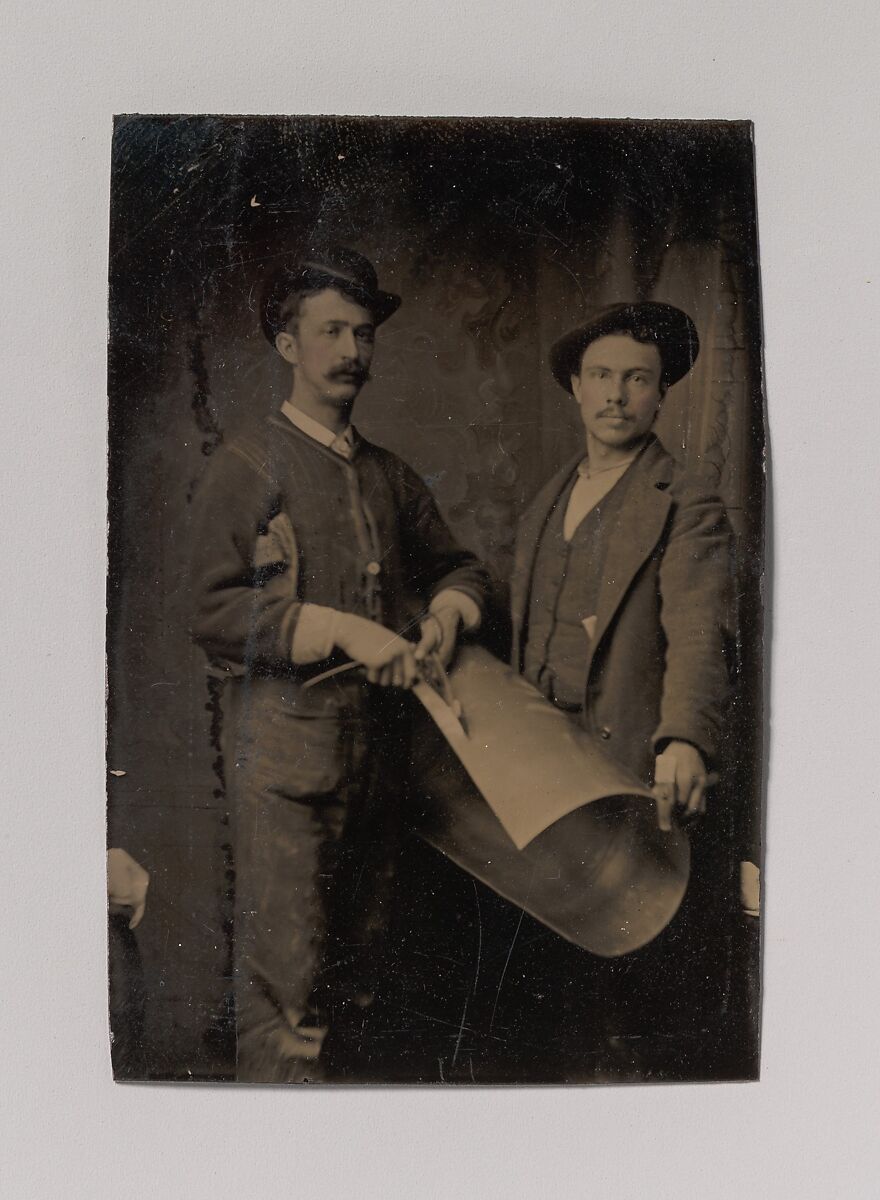 [Two Tinsmiths Cutting a Curled Sheet of Metal], Unknown (American), Tintype 