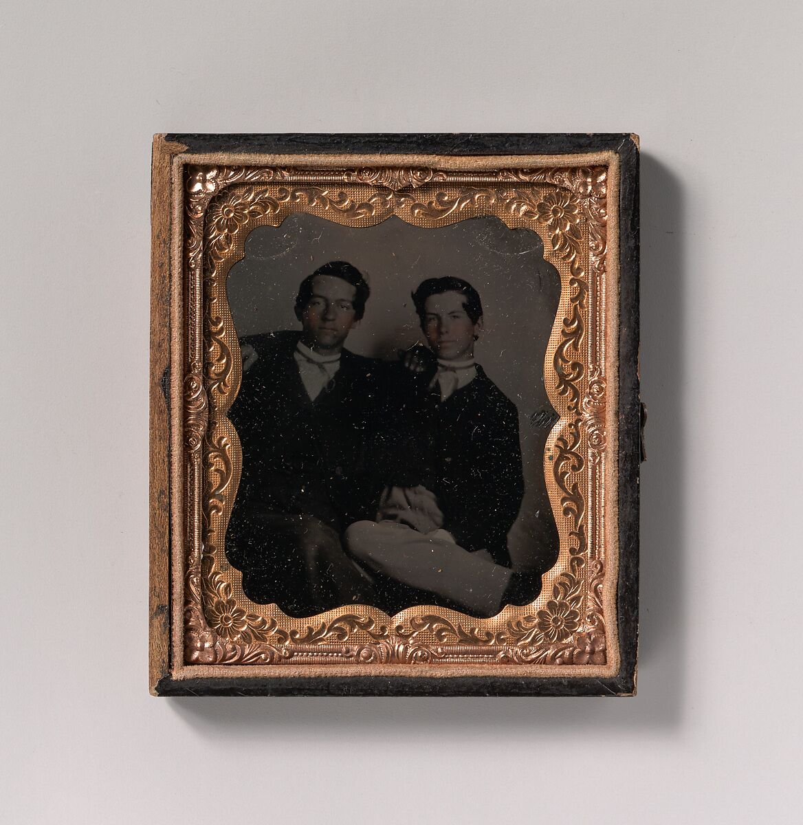 [Two Young Men Seated with Their Arms Around Each Other], Unknown (American), Tintype with applied color 